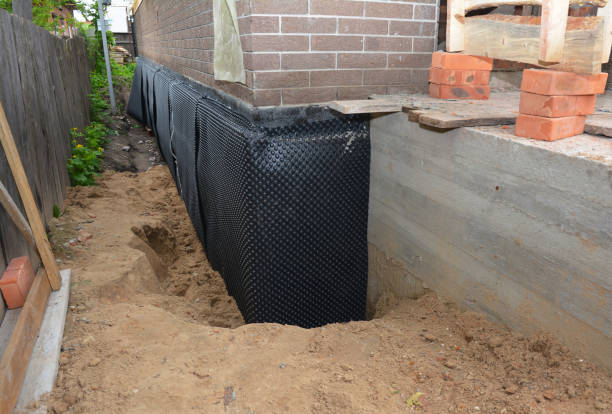SJ Waterproofing Pros technician performing targeted Foundation Crack Repair assessment in West Jefferson, OH